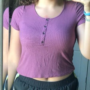 pink/purple button down crop top.